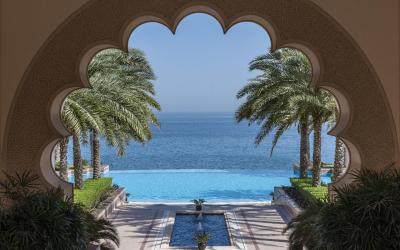 Al Husn pool through courtyard arch A