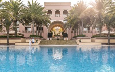 Al Husn main pool in late afternoon with people A